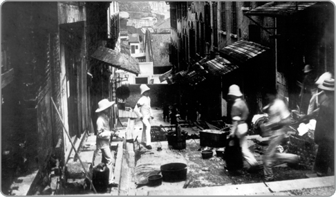 Streets being disinfected by officials in 1844. Notice the word "DONE" painted on the building on the left.
