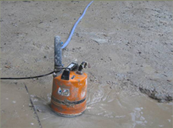 Use of light duty sump pump to clear stagnant water on the floor