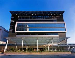 Installation of photo-voltaic panels at the roof of a hospital to provide sun shading to the upper floors and generate renewable electricity for general building use